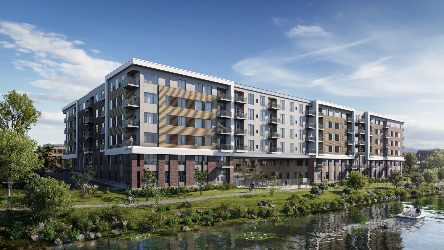 Riverfront mid-rise apartment development located at 100 North Broadway in Aurora, Illinois, featuring an open central courtyard with switchback ramps providing immediate access to the Fox River Trails, designed by Pappageorge Haymes Partners.